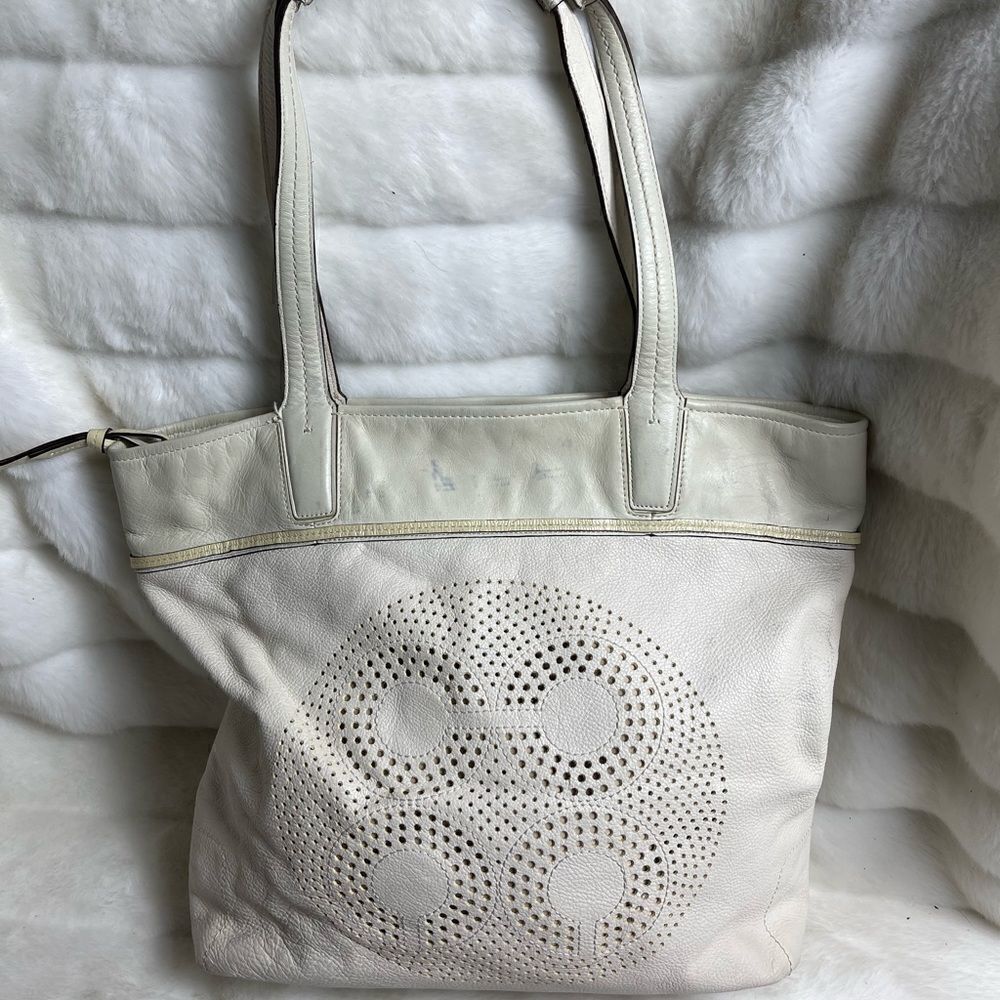 Coach leather beige tote bag with front laser cut logo design .